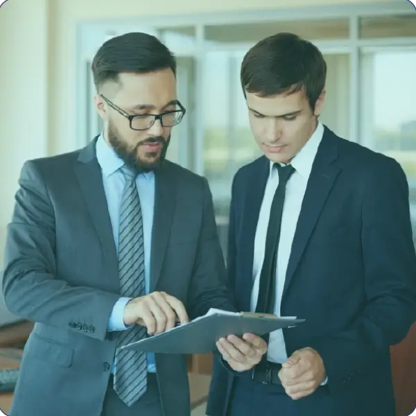 Professional MBA consultant working with diverse client in modern office, one-on-one consultation session, warm lighting, collaborative atmosphere, professional photography